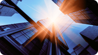 Image from below looking up at office buildings signifying growth for High-Yield accounts.